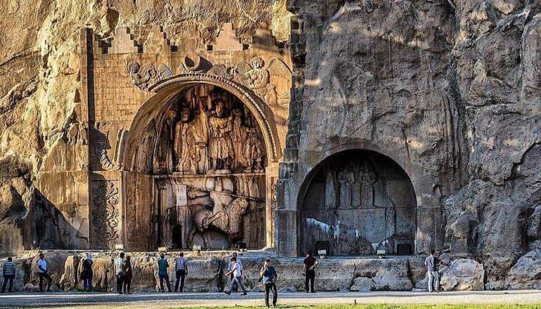 Stone carving of Taq Bostan - travel guide to Iran